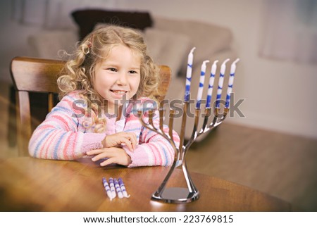 Hanukkah: Girl Excited To Light Hanukkah Candles