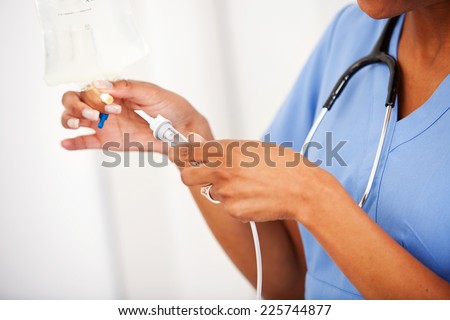 Hospital: Nurse Preparing IV Needle For Patient