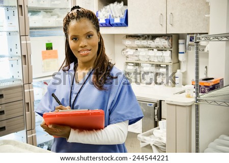 Hospital: Smiling Nurse In Supply Room