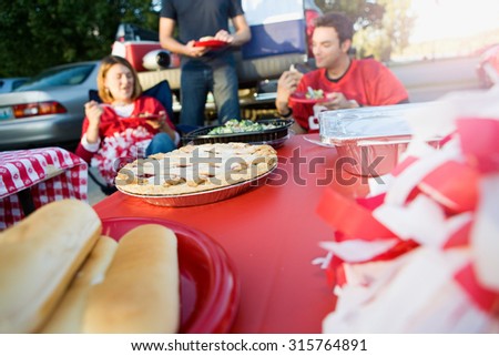 Tailgating: Focus On Apple Pie On Table Of Tailgate Party Food