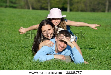 Happy young family. On vacation in the park