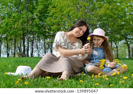 Mom and daughter on vacation in the park