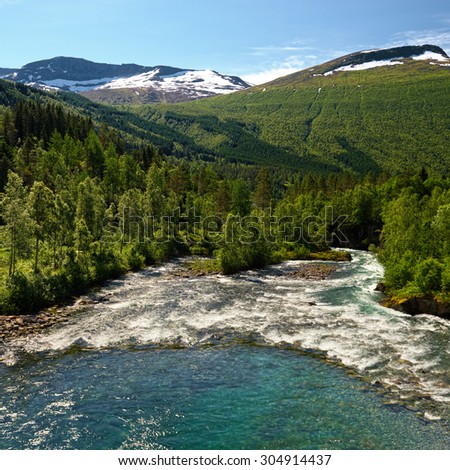 Beautiful mountain river with blurred waves of water. Norway. Travel. Scandinavia