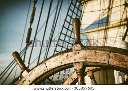 Vintage Helm. Toned image and blur. Retro style postcard. Tall Ship. Yachting.  Sailing