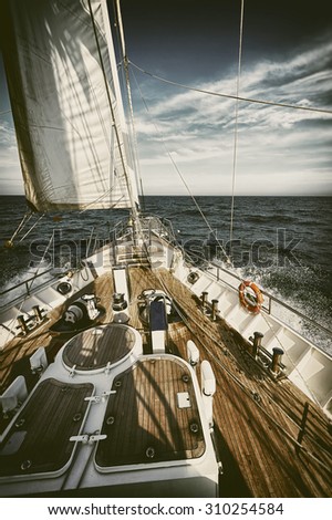 Sailing yacht in a storm.  Toned image and blur. Retro style postcard. Sailing. Yachting. Travel