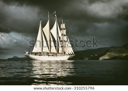 sailing ship on the background of stormy sky. Toned image and blur. Retro style postcard. Sailing. Yachting.