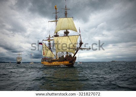 Sailing ship on the background of stormy sky. Yachting. Sail. Tall ships