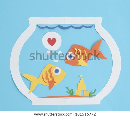 Paper fish cut-outs in love