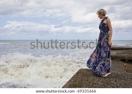 Beautiful woman looking at the ocean
