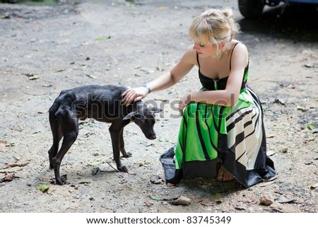 Woman with a poor stray dog