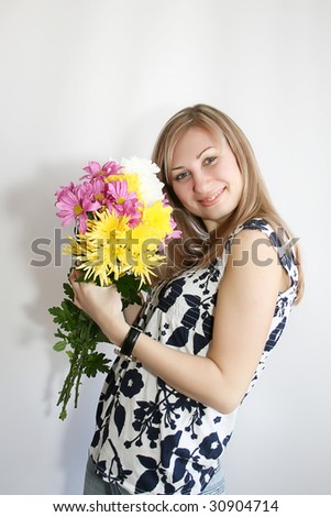 Happy young smiling woman with bunch of flowers