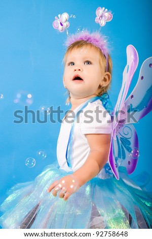 beautiful girl in a fairy costume with butterfly wings