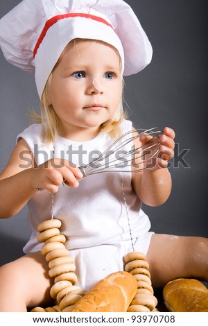 Happy little girl with chef hat