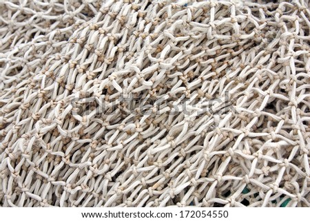 Fishing net background with shallow DOF - Hand crafted fishing net knots
