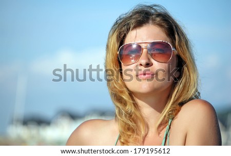 Beautiful  woman portrait fashion style outdoor enjoying  - Young Cacasian woman smiling fashion close up shoot by the sea