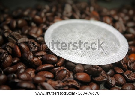 Coffee pods on coffee beans shallow DOF background - Coffe pods  modern filter coffee replacement