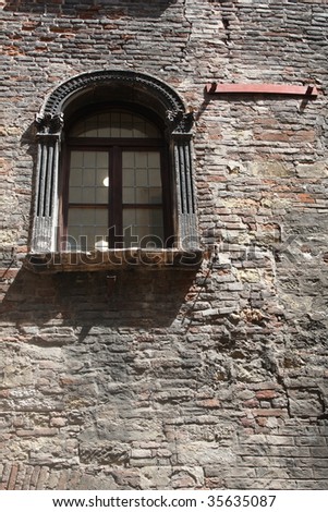 Gothic style Italian facade detail - window and beautiful wall texture