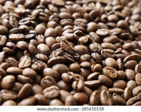 Shallow DOF roasted coffee beans arabica type refreshing product - Shallow DOF whole arabica coffee beans background