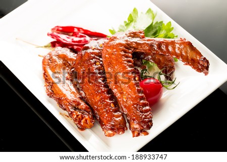 Braised duck wings, Chinese cuisine.