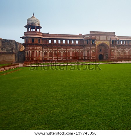 Green grass plot surrounded by wall and tower, Red Agra ford, India