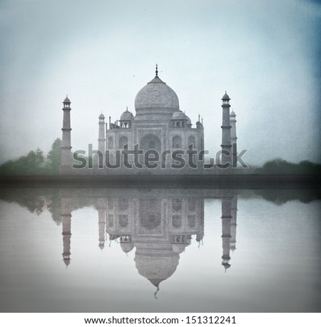 Taj Mahal in twilight trough the fog with water reflection (high level the digital noise)