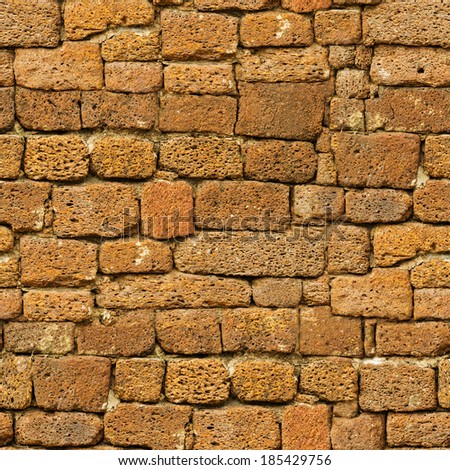 Seamless vintage pattern - old brown rough natural stone wall