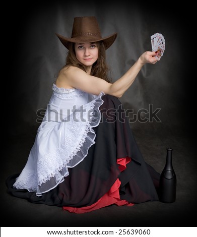 Girl with a playing-cards in hand on black