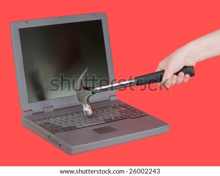 The laptop and hammer on female hand