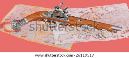 Ancient pistol on antique maps background
