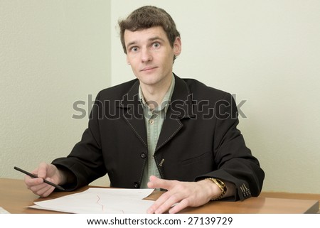 The clerk at office sits at a desktop