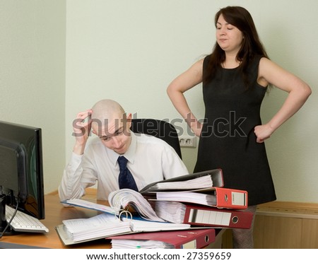 The bookkeeper and the secretary on a workplace at office