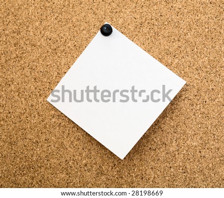 Stickers pinned to a brown cork board
