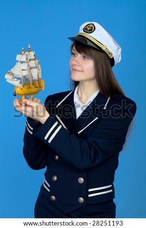 Portrait of the woman in a sea cap with the ship in hand