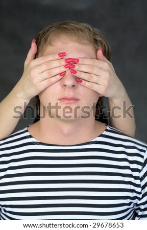 Female hands have closed to the man of an eye