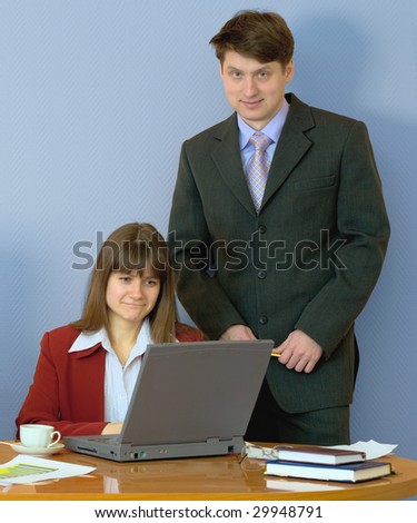 Girl sitting at a desktop and their chief
