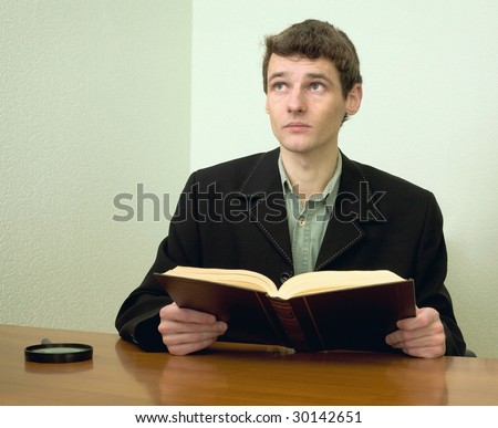 The man read book on a workplace