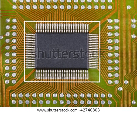 Small microcircuit soldered to an electronic plate near to other components