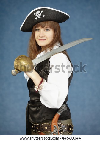 The beautiful woman in clothes of the pirate on a dark blue background