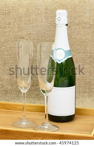 Still life from a bottle of sparkling wine and two wine glasses