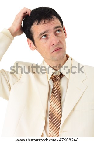 Puzzled man scratches his head, isolated on a white background