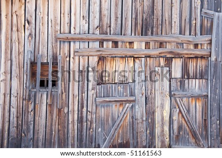 Wooden wall old country barn with a window and door