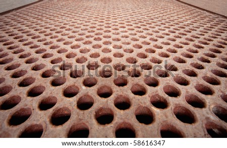 Rusty metal lattice close up - the heat exchanger