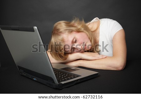 Young woman tired from work in the internet and went to sleep