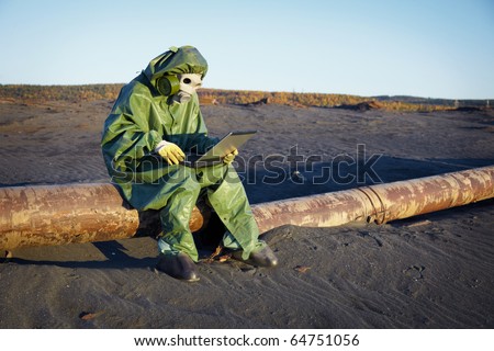 Environmental scientist working in the zone of ecological disaster