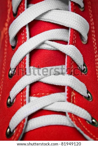 Red old-fashioned gym shoe - lacing
