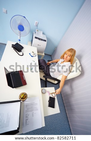 A pretty young secretary on workplace in the office