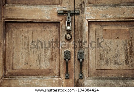 Old wooden door with ornaments, Locked wooden door, secret, mystic, Process in vintage style color.