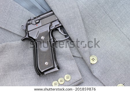 Semi-automatic handgun in business suits, 9mm pistol.