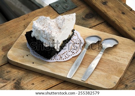 White Cake set on a crate, wood background, Vintage Style Cafe.