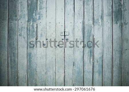 Old wooden gate with faded paint, Vintage wooden door.